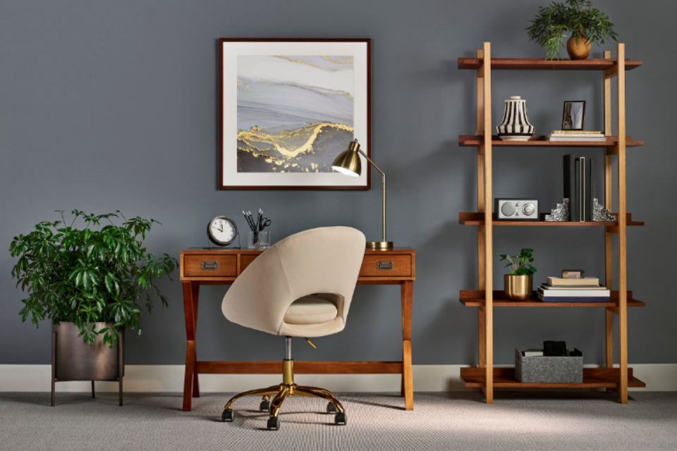 basement home office with carpet flooring